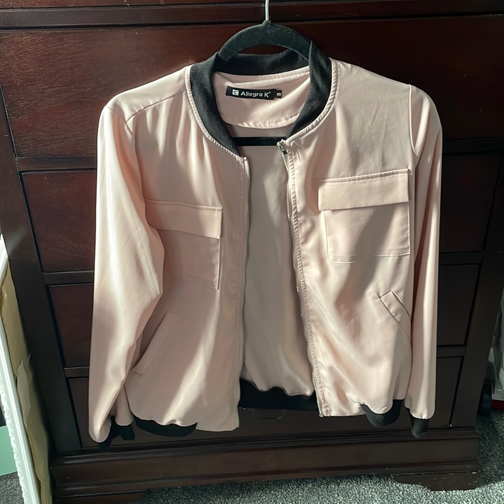 Blush light weight bomber jacket. Never worn. However I did remove the tags .